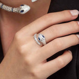 APM Monaco serpent open ring with navy blue stones in white silver