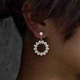 APM Monaco Asymmetric Sun Earrings with pearls in white silver